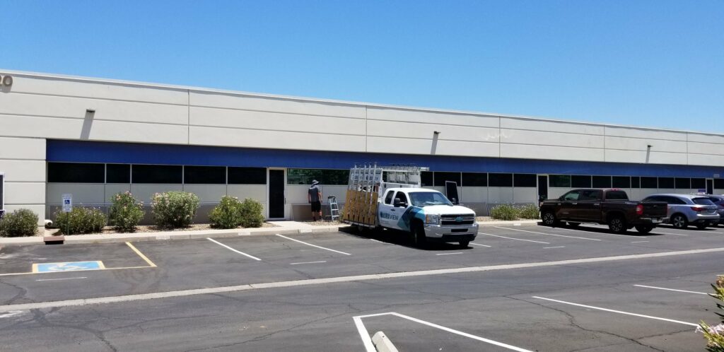 sunscreen being installed on commercial building in phoenix by true view windows team